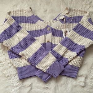 Cropped, purple and white striped sweater.